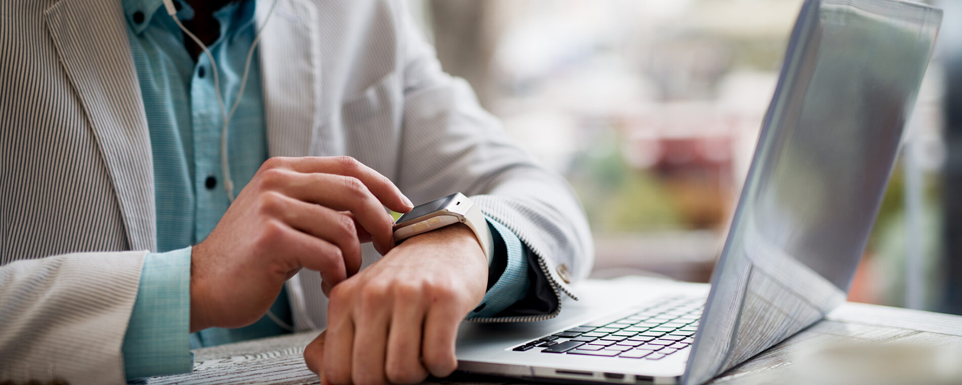 Guy checking his smart watch.