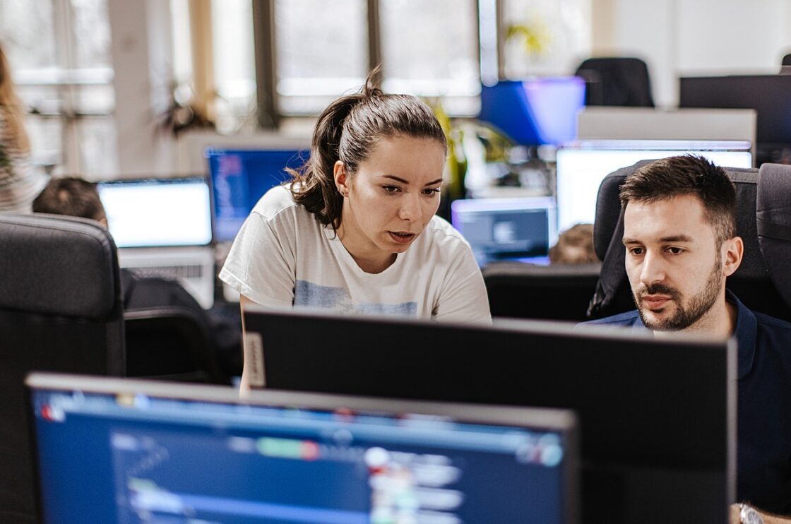 colleagues working at a computer