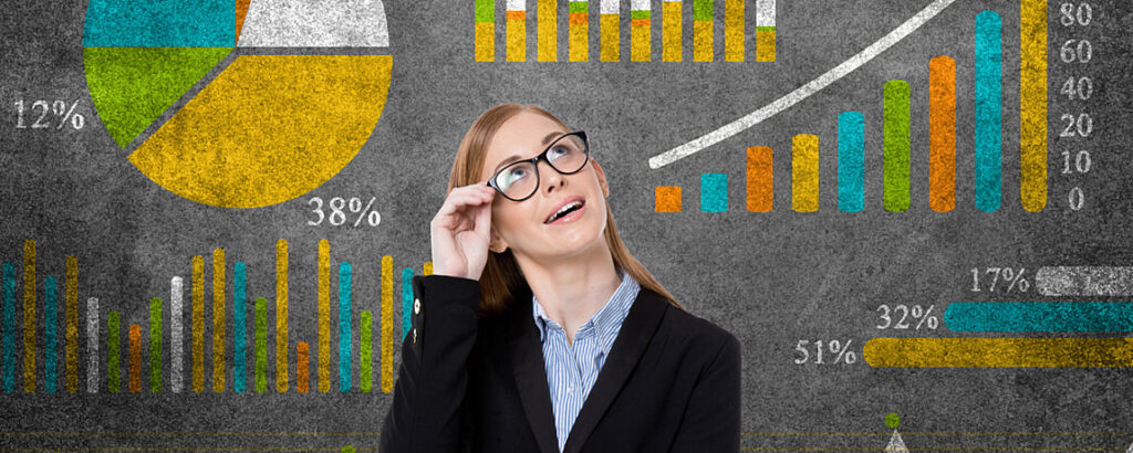 Woman standing and looking up, while moving her glasses.