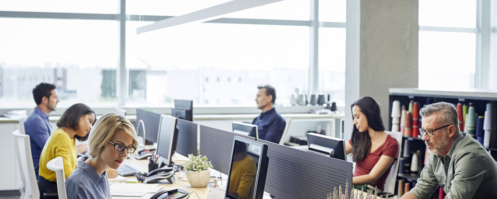 Business People working on their computers, together.