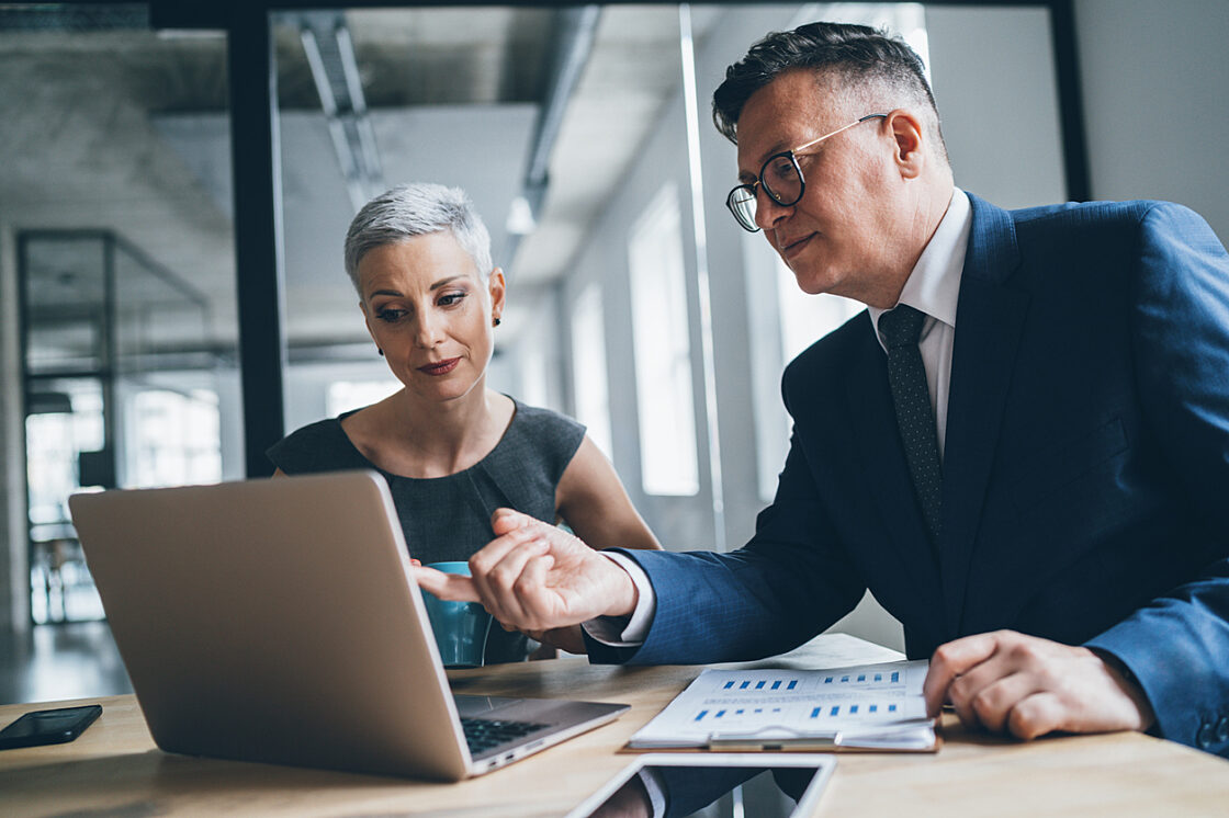 two business professionals taking a SaaS security assessment questionaire online