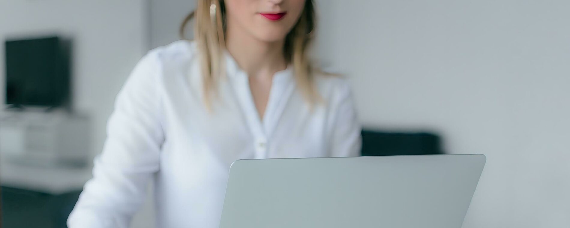 Woman using a laptop.