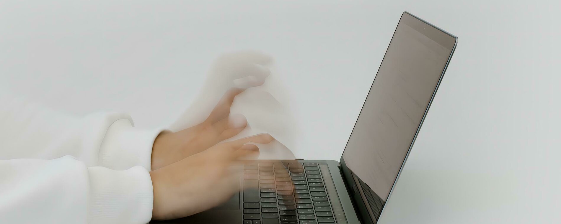 A person typing wildly on their laptop!