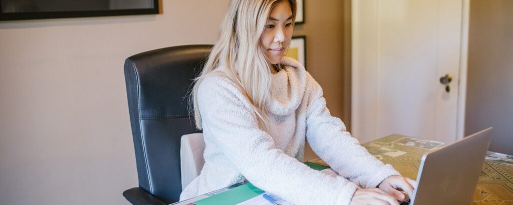 Woman sitting in her office and using her computer.