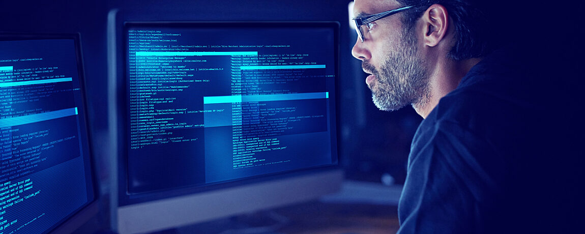 Man focusing on the work he's doing on his computer.