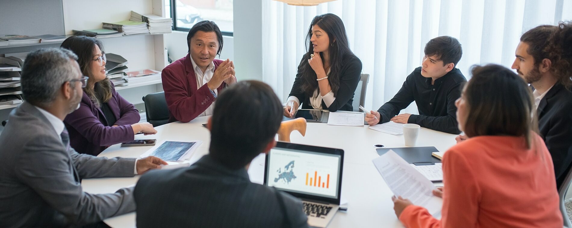 A group of people having a meeting.