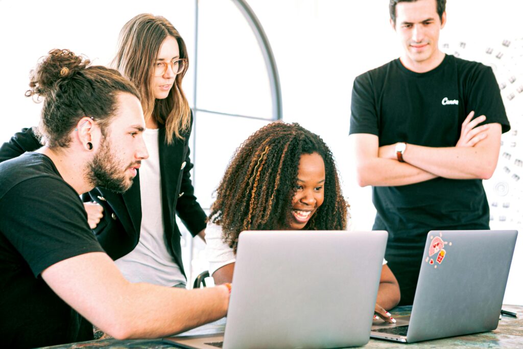 a team around two computers