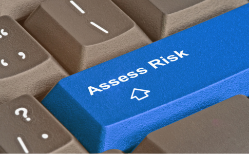 computer key that says asess risk